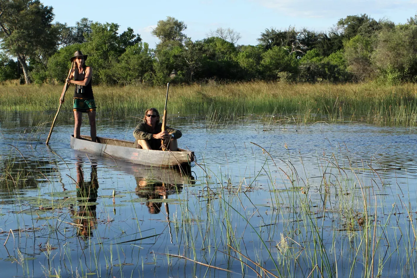 Two people in a mokoro