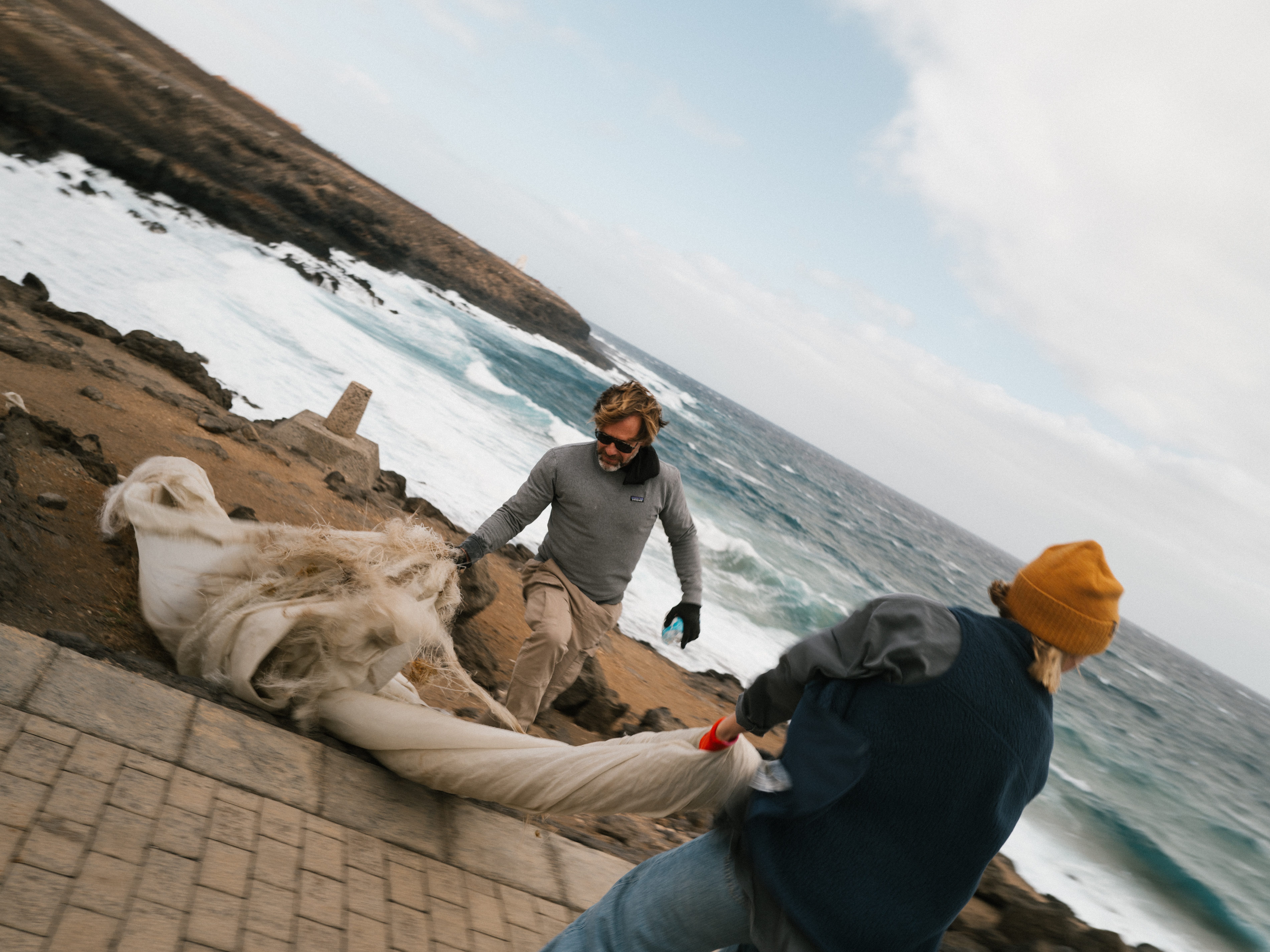 Volunteers cleaning up pollution off the beach
