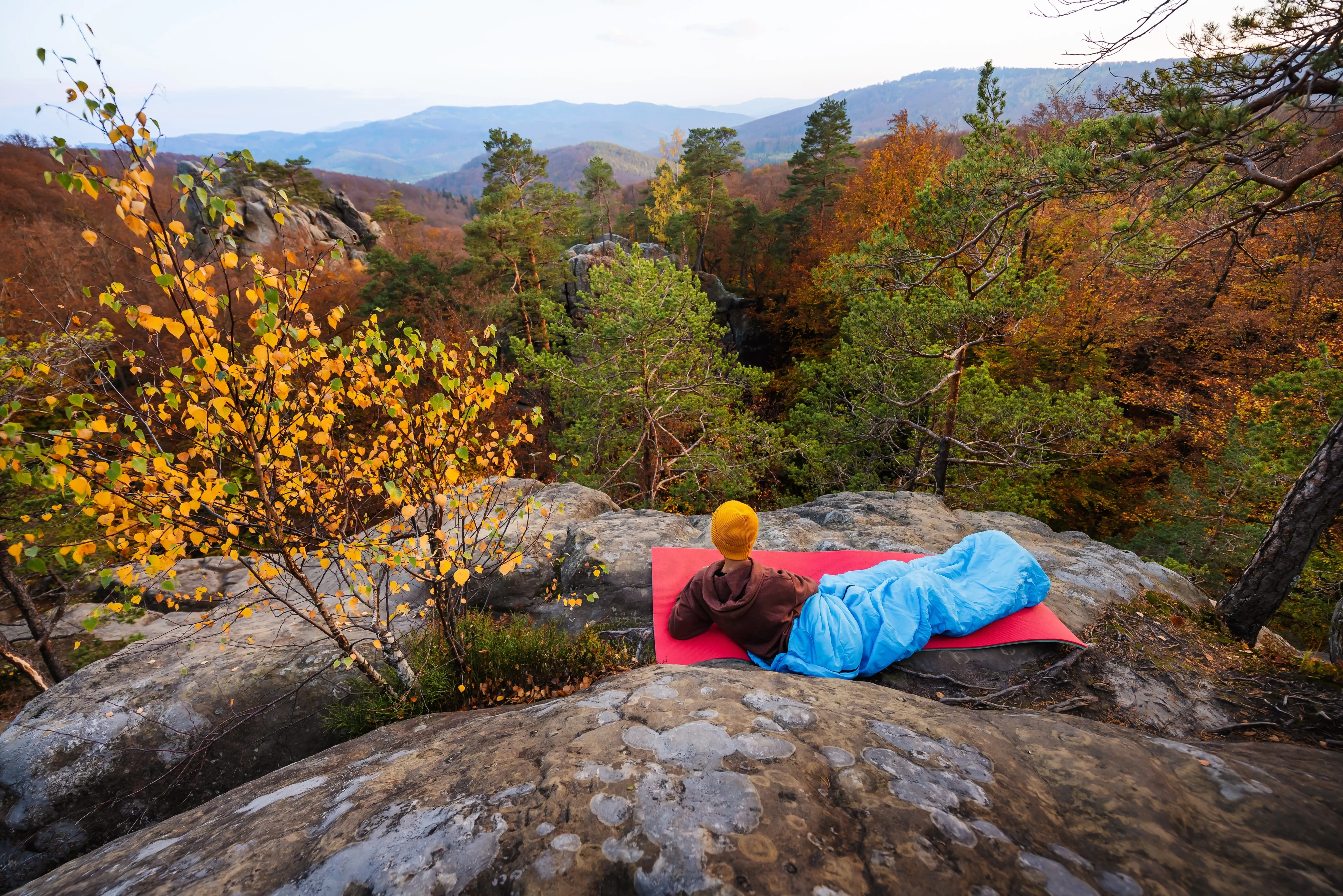 tourist camping on rocks