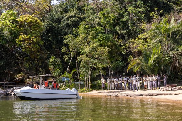 Team welcoming guests back from fishing