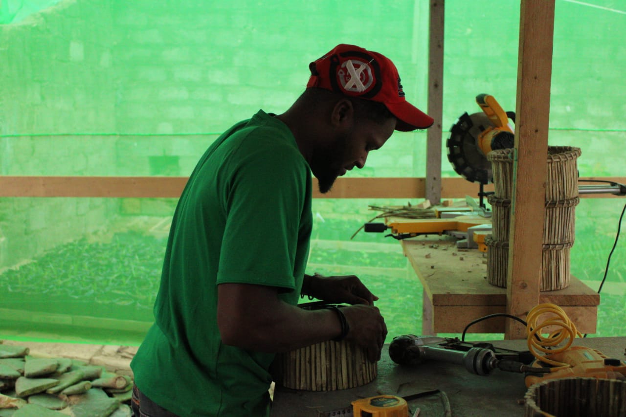 Staff member trying to fix broken equipment