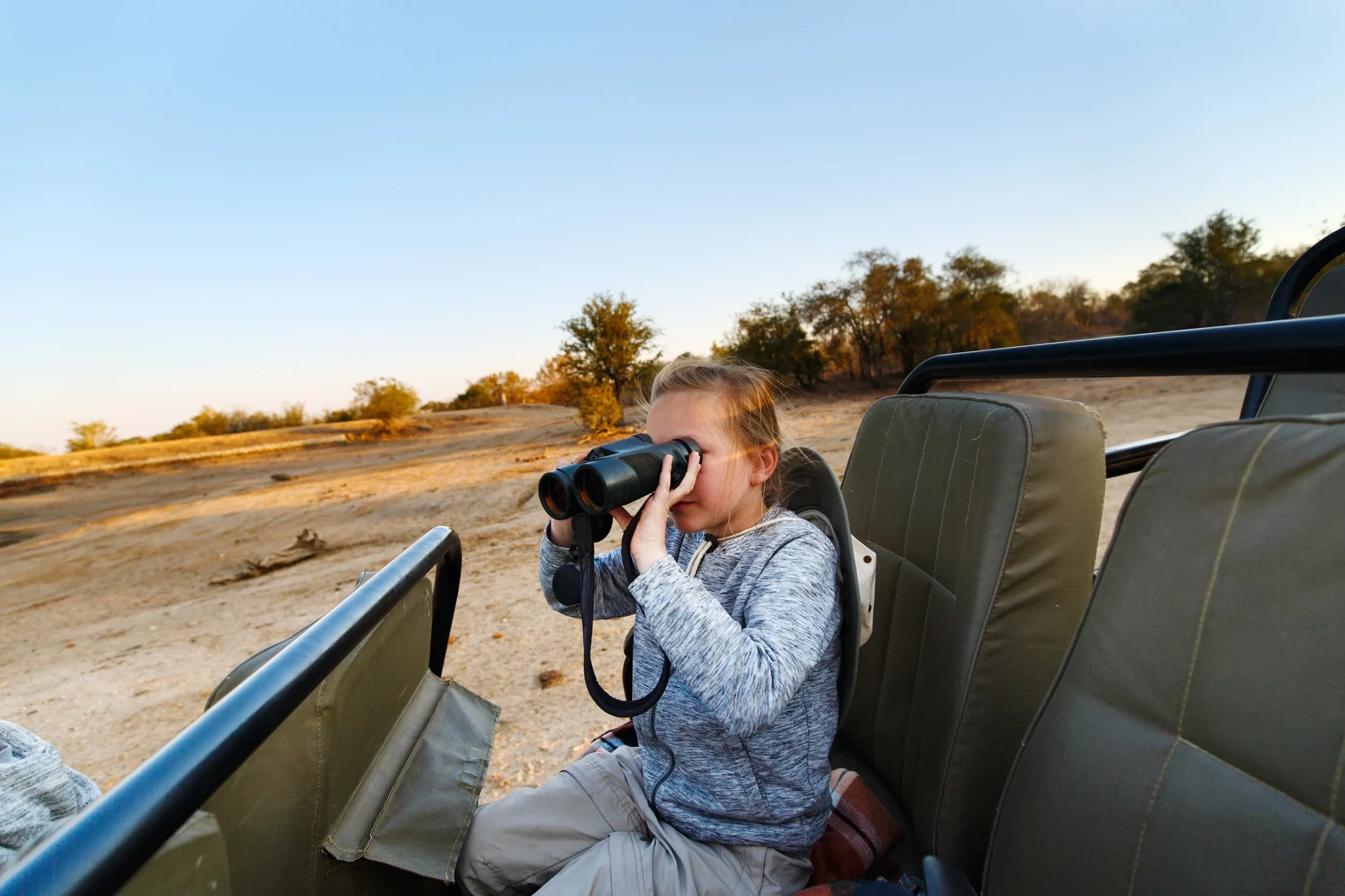 Girl looking through binoculars