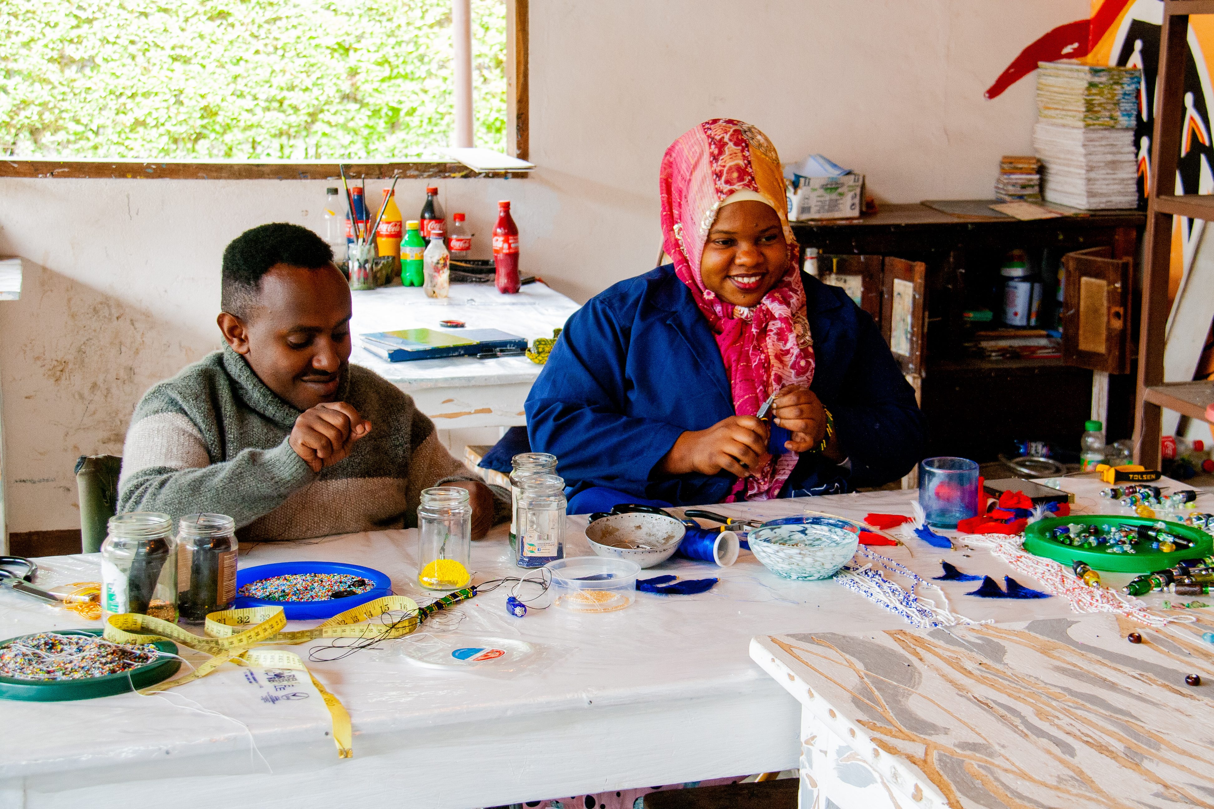 Employees building necklaces