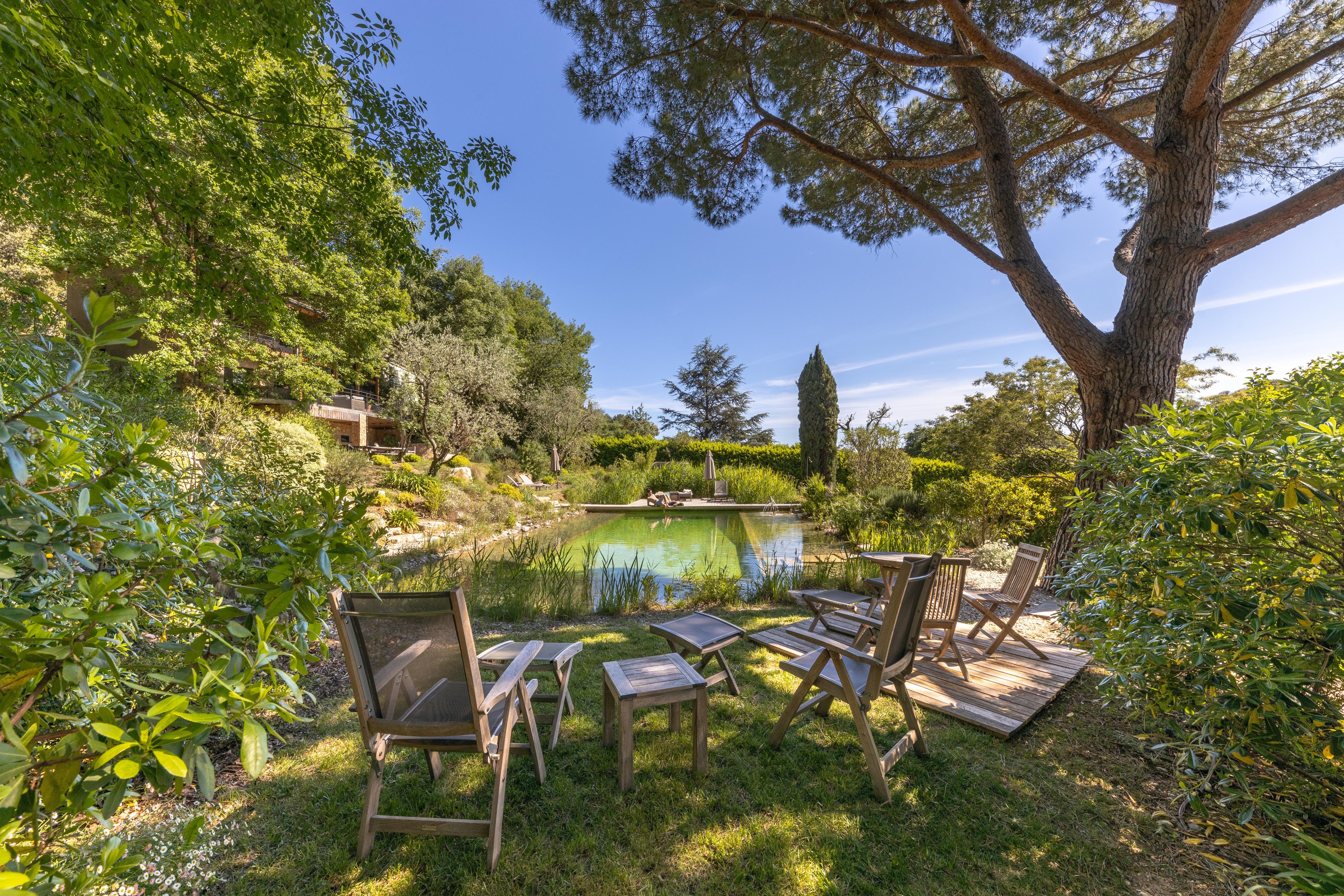 pool view with chairs and tables