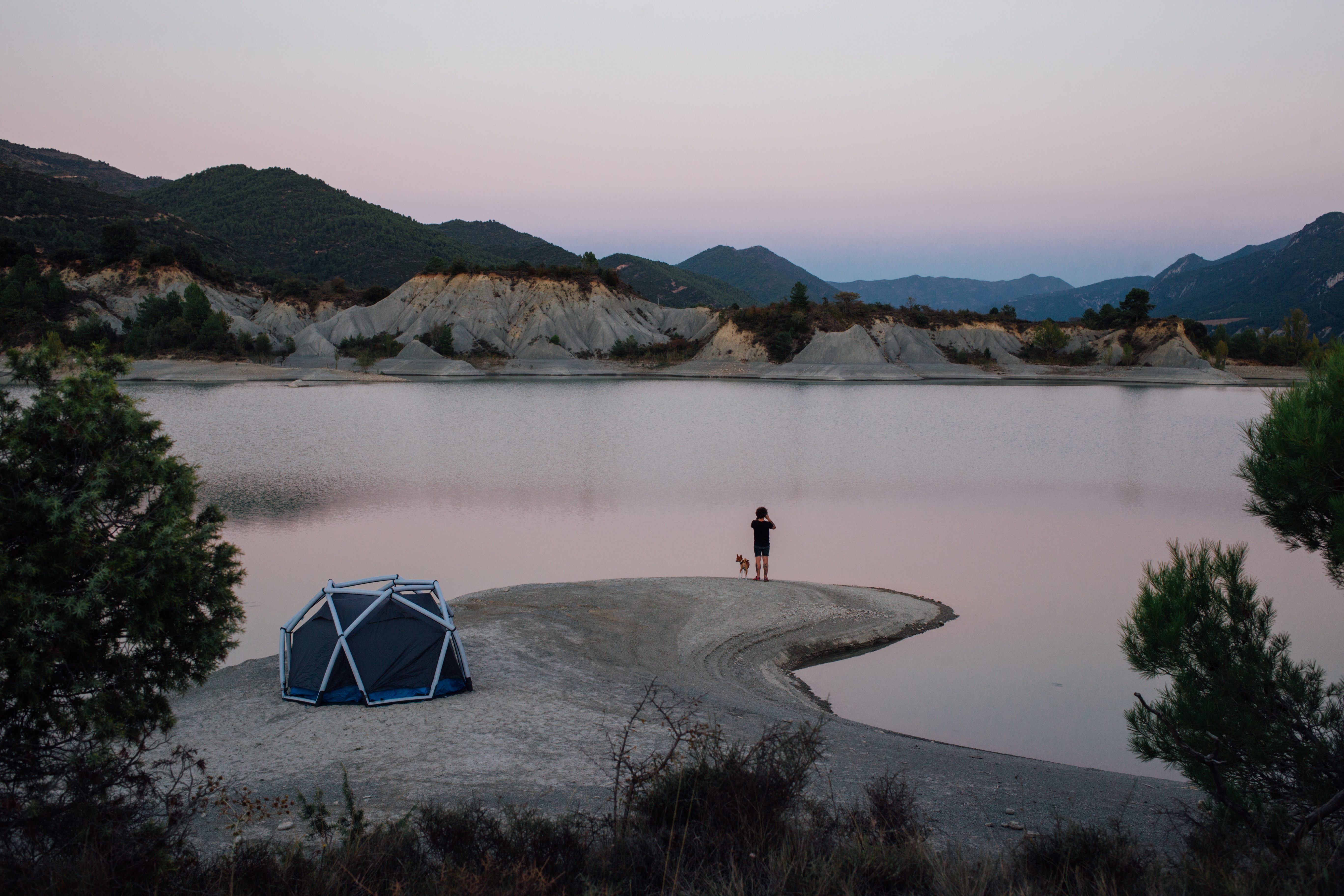 man setup by lake