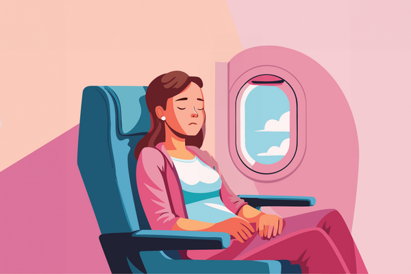 Woman sleeping in a plane seat