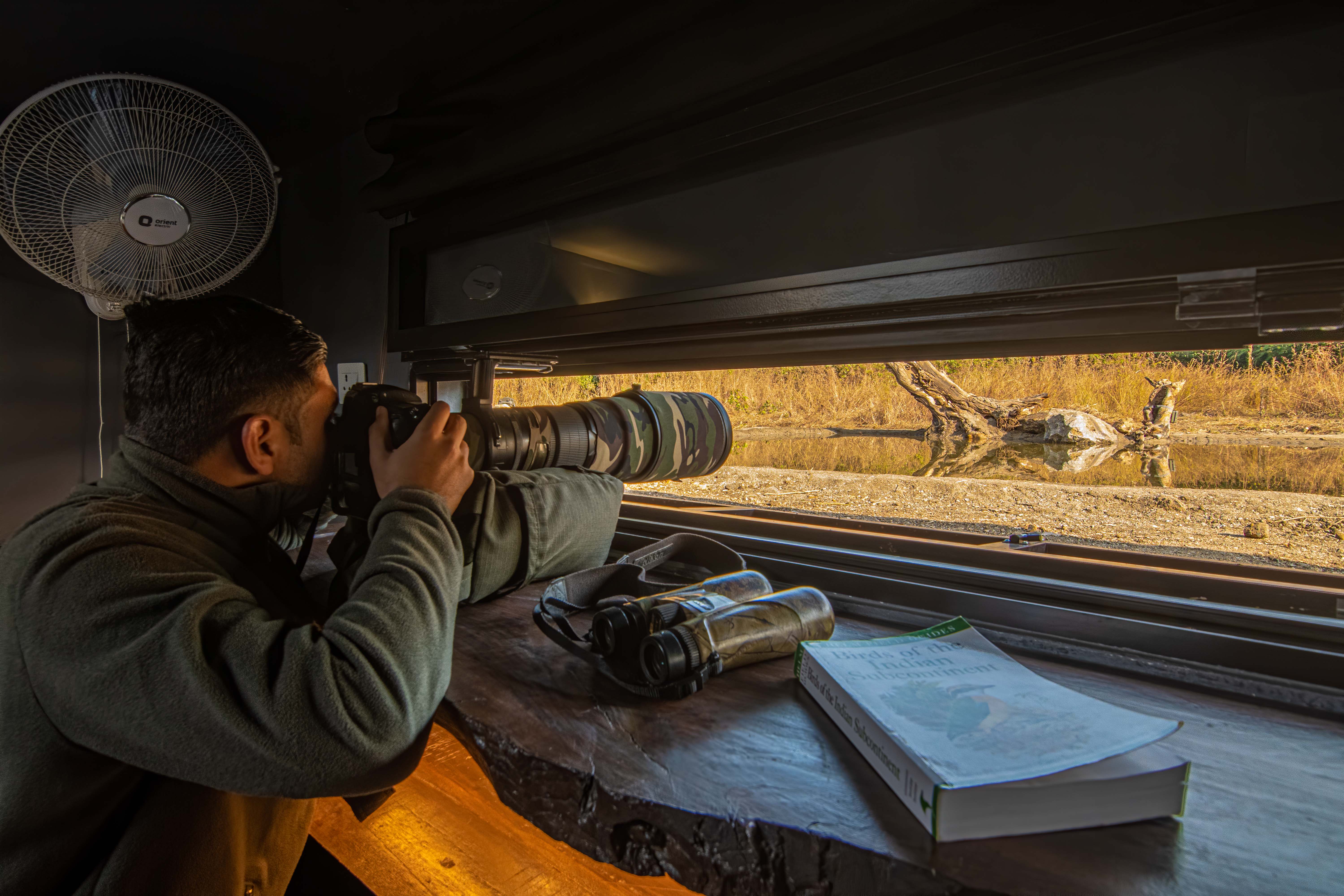 Guest taking photographs from the Kipling hide
