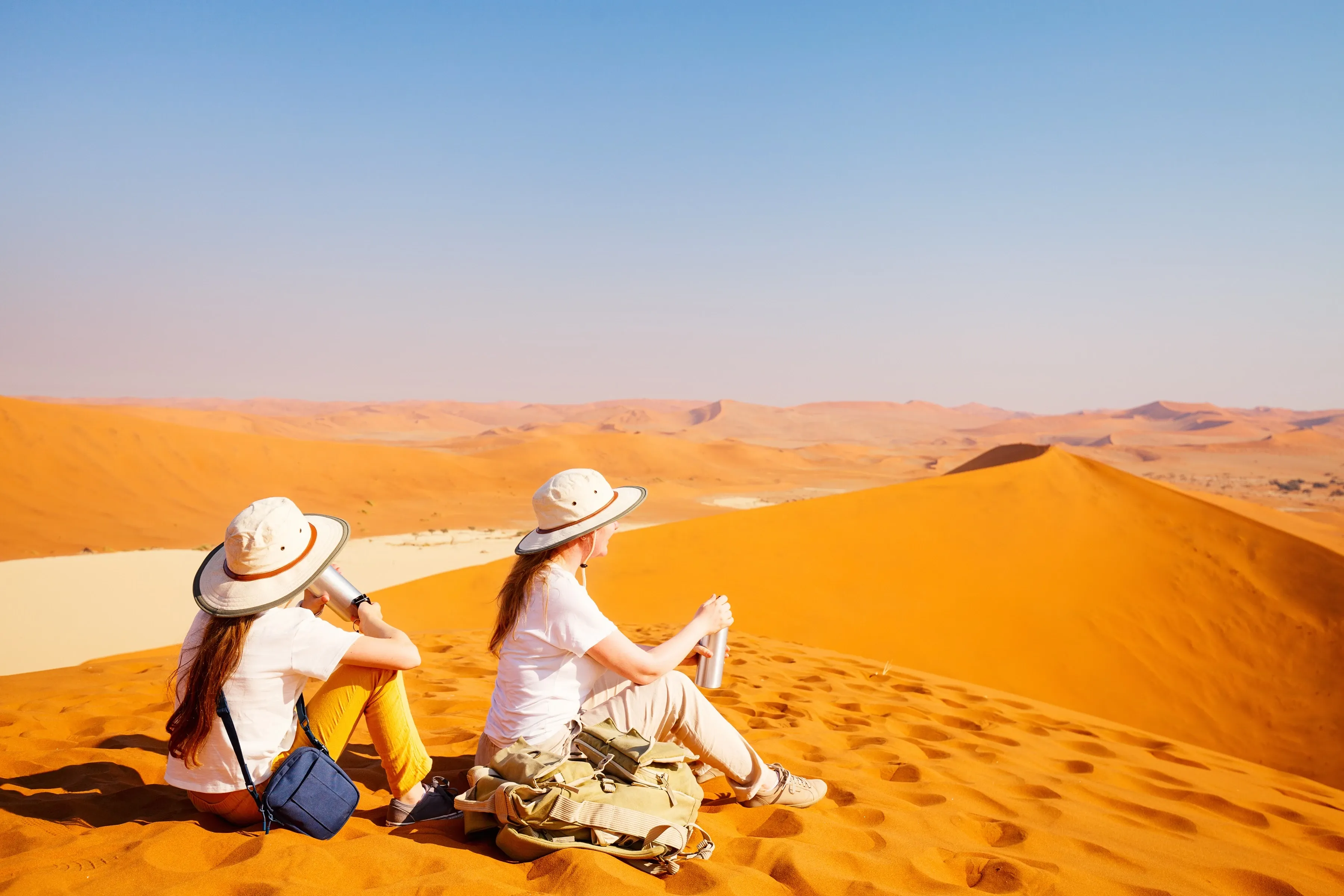 Family sitting in namib desert