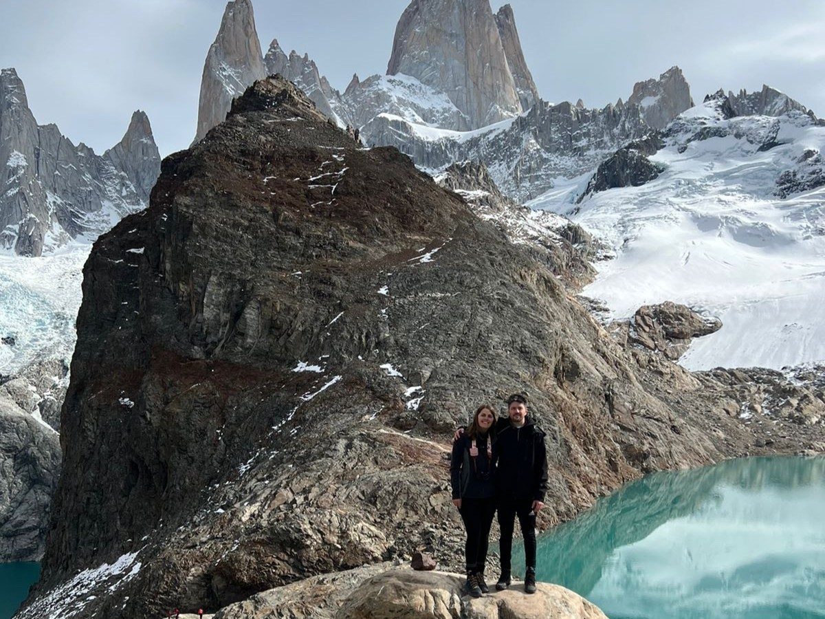 Team photo by glaciers and lake