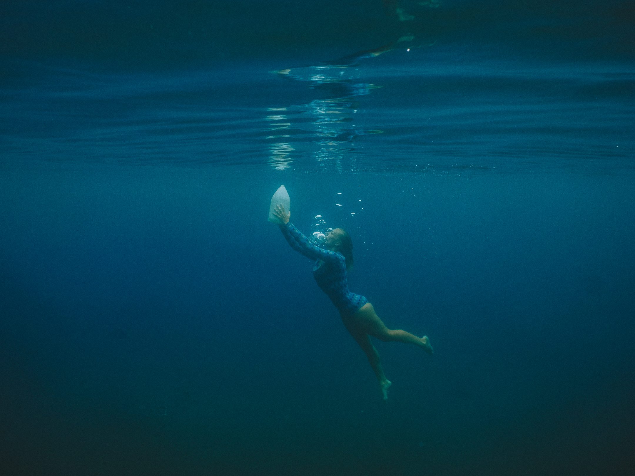 Team resurfacing plastic from the bottom of the ocean