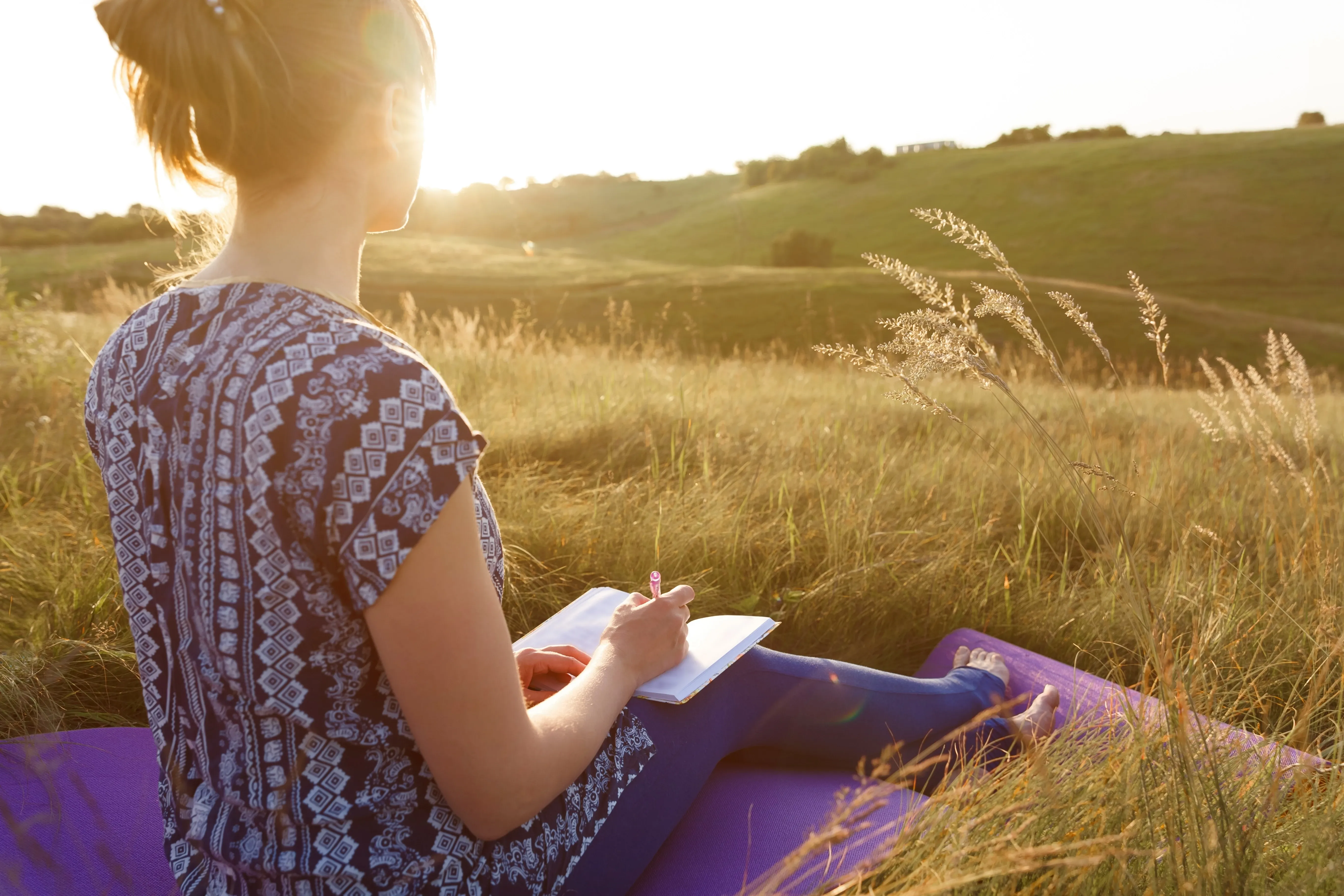 Girl journaling in nature