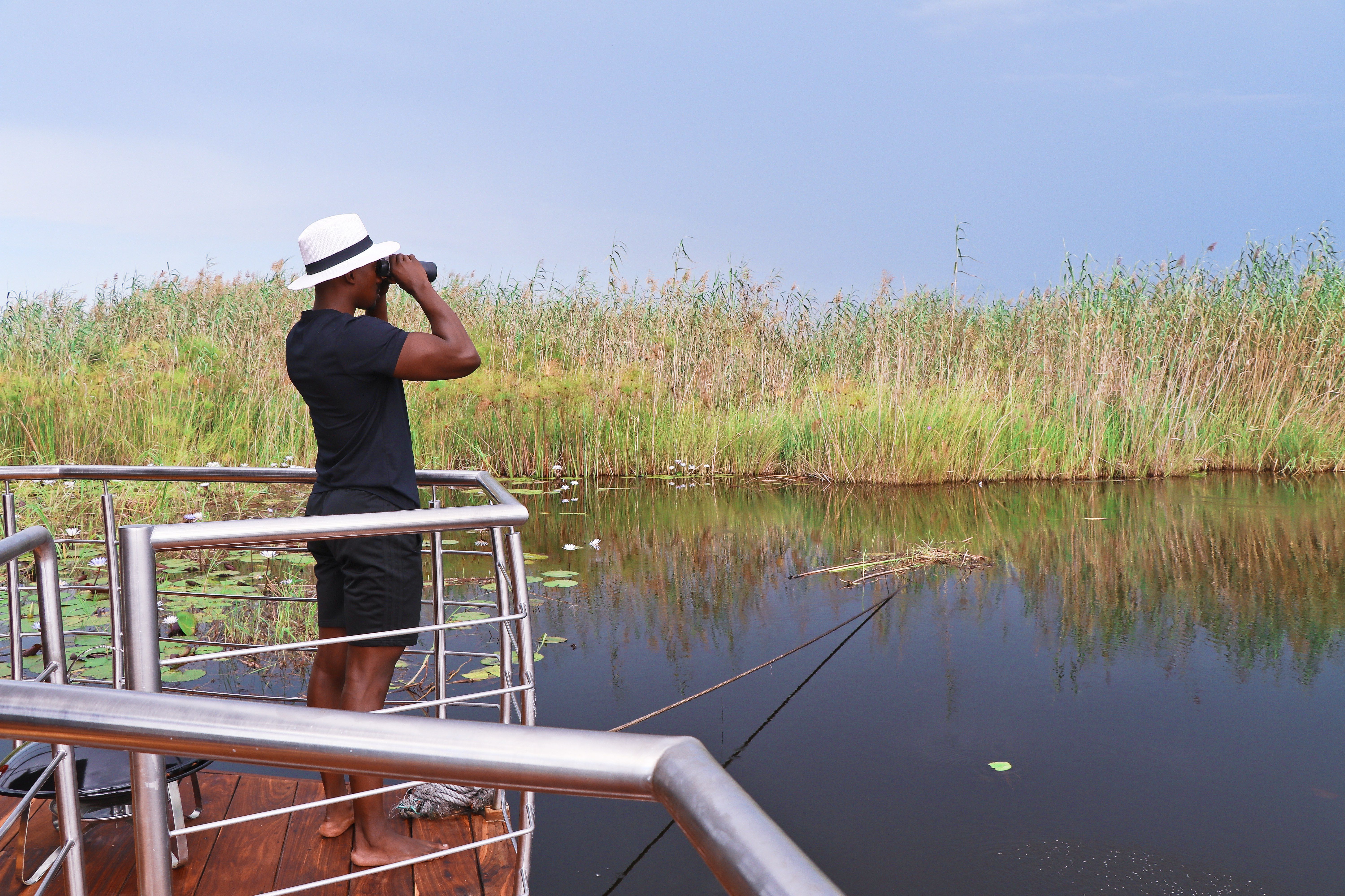 Man watching wildlife with binoculars in Namibia