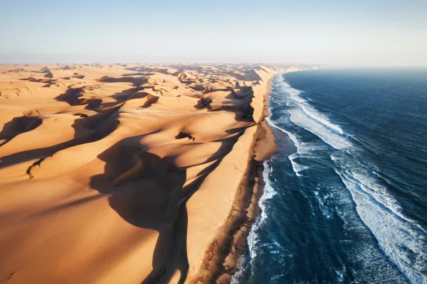 Coast of Namibia from above with dune and sea