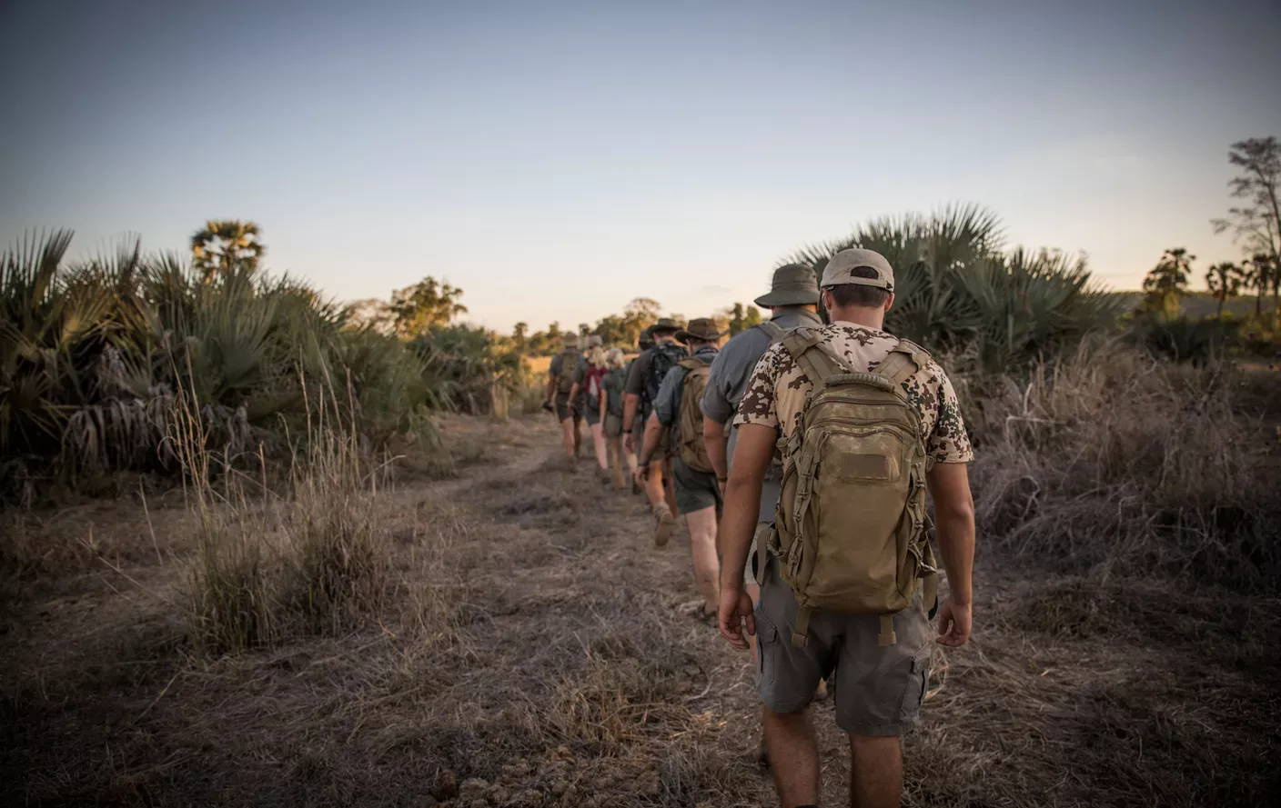 People trailing in a row