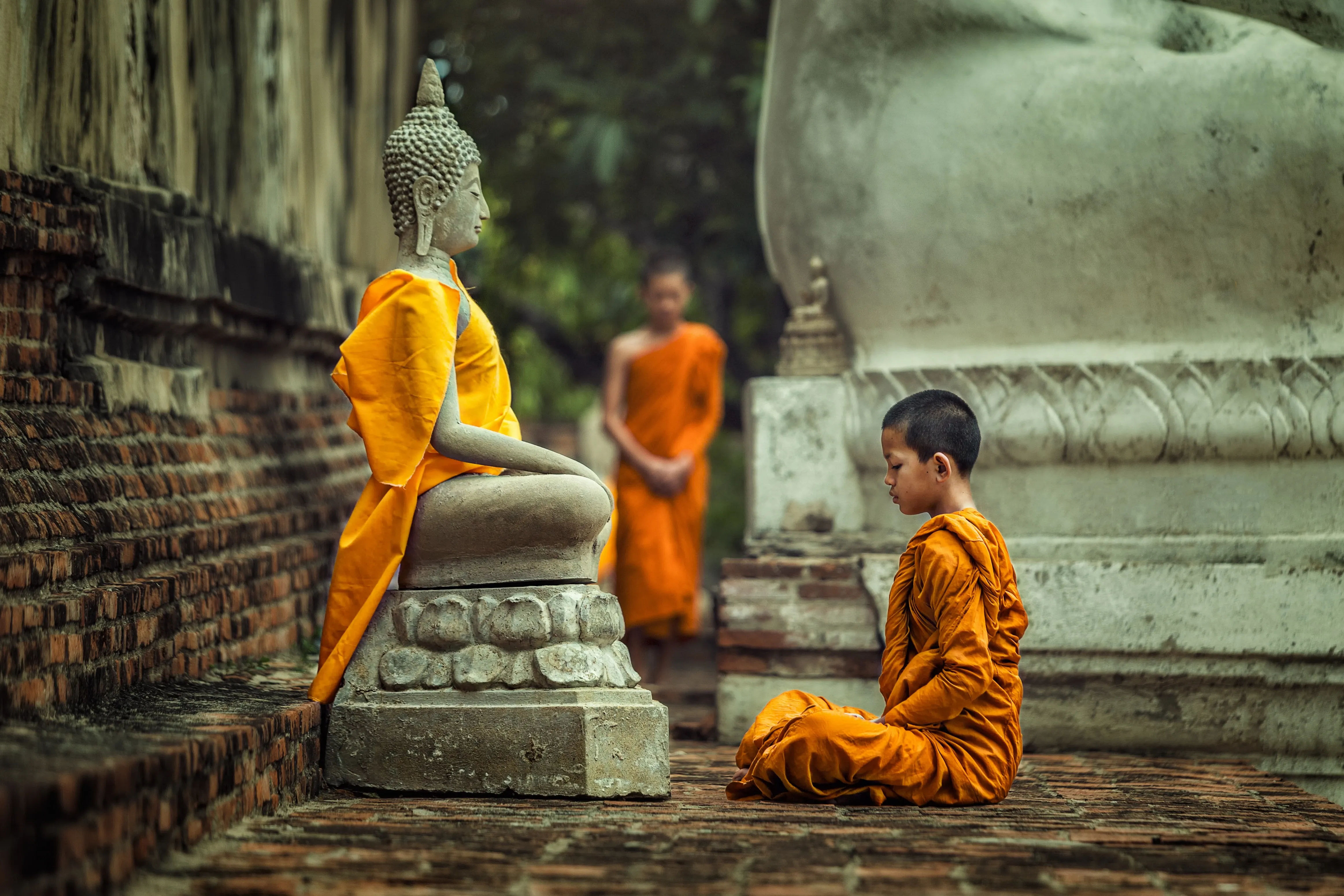 child monk praying