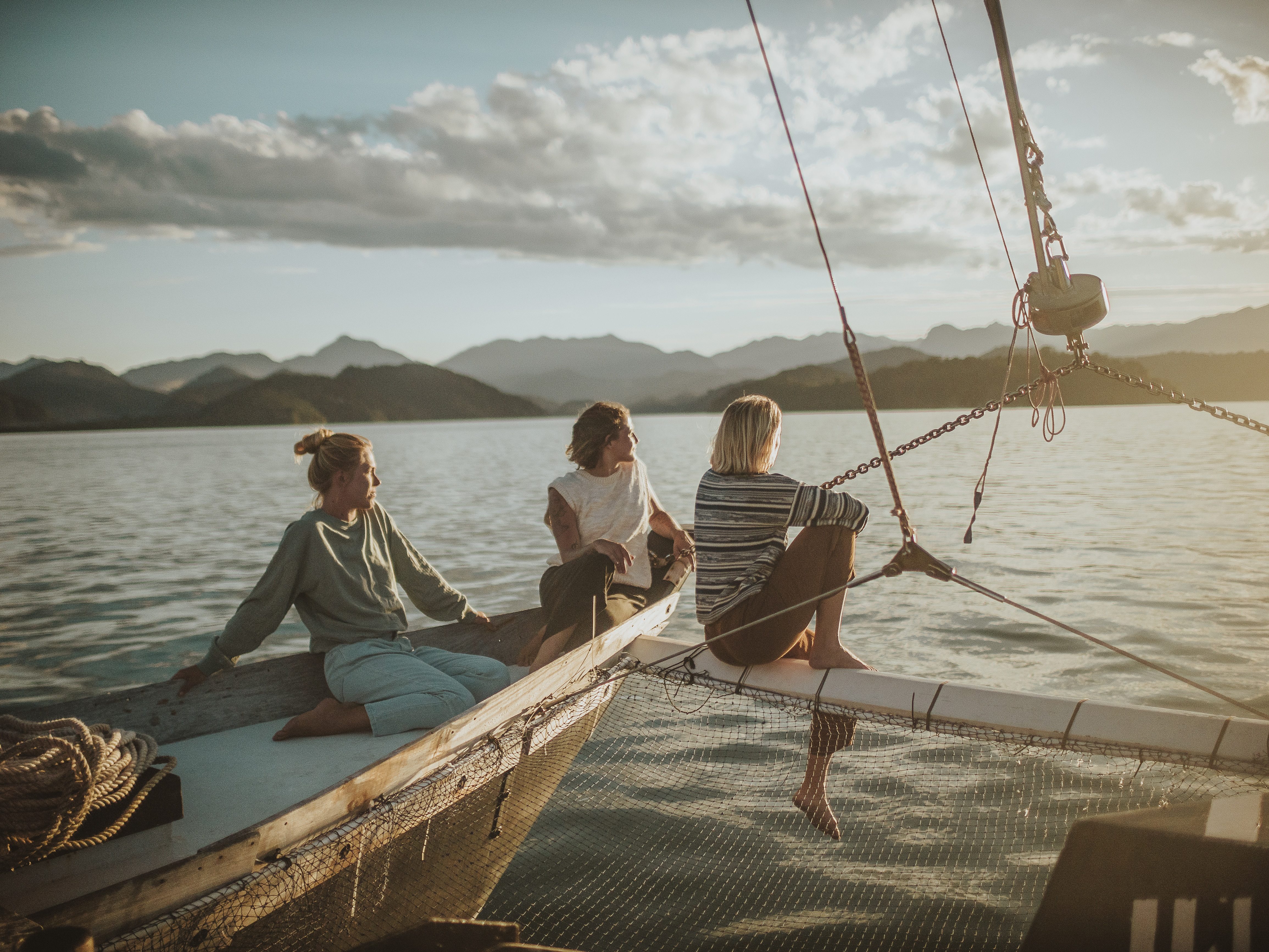Woman and the wind looking out towards the sun