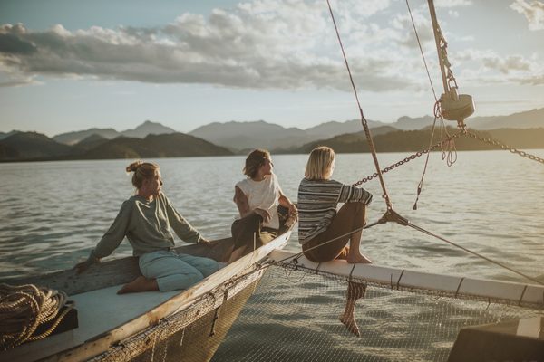 Woman and the wind looking out towards the sun