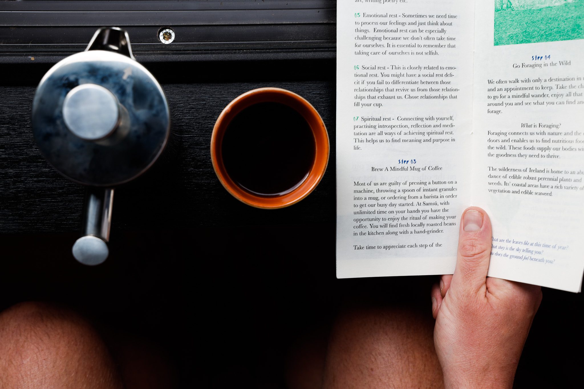 traveller enjoying coffee and book