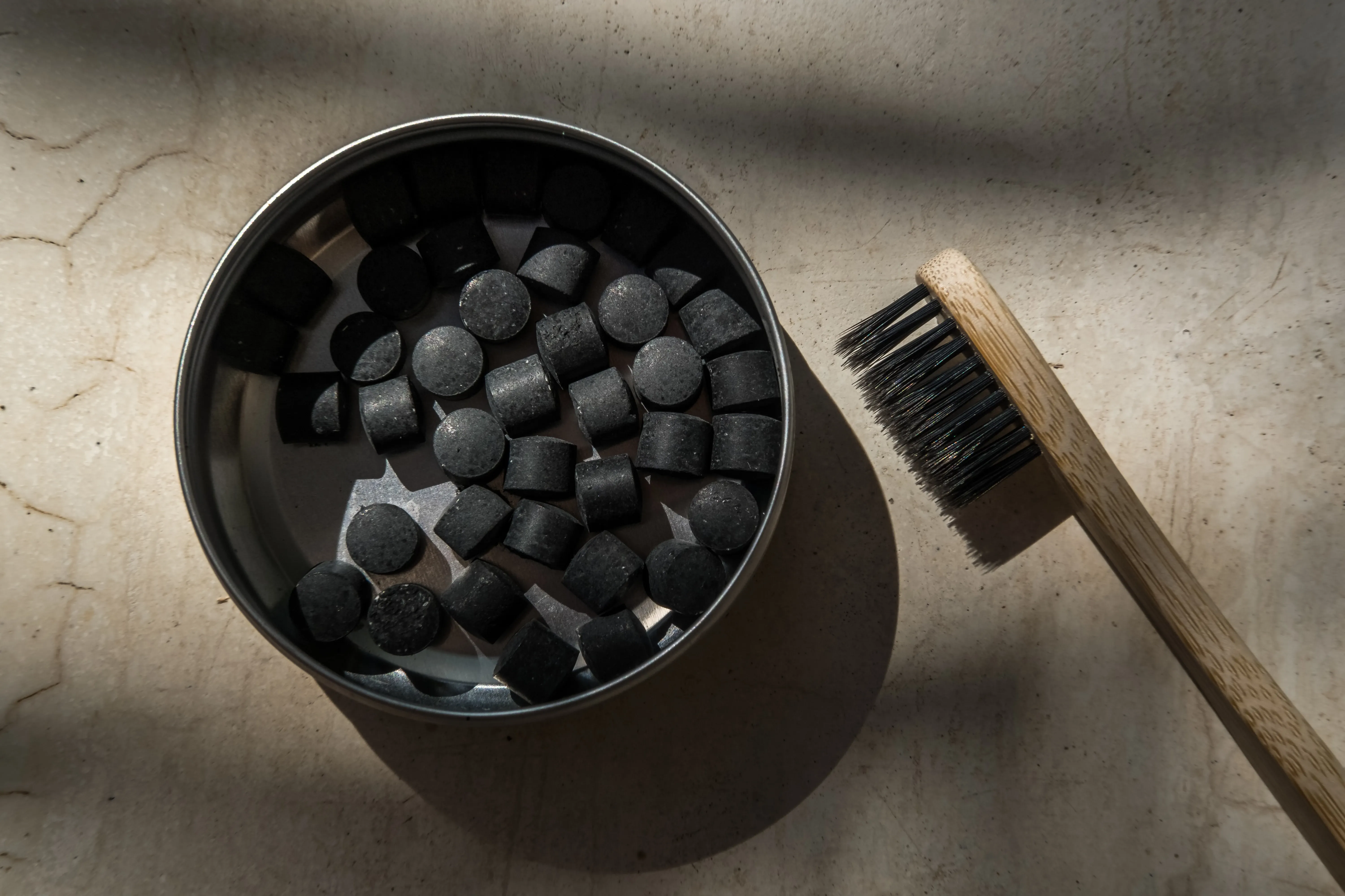 Toothpaste made from activated charcoal in a tin