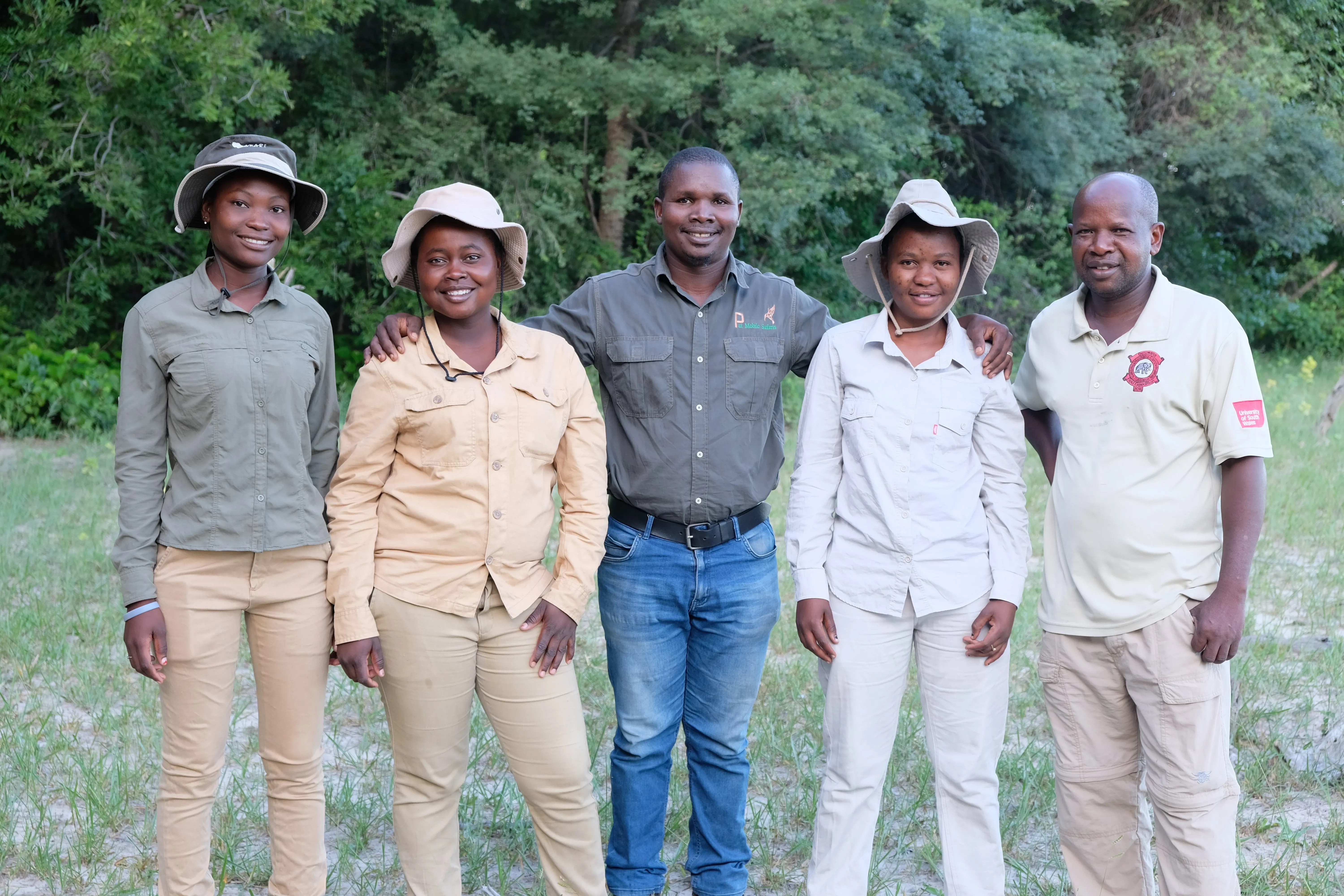 Five smiling people in uniform, Botswana