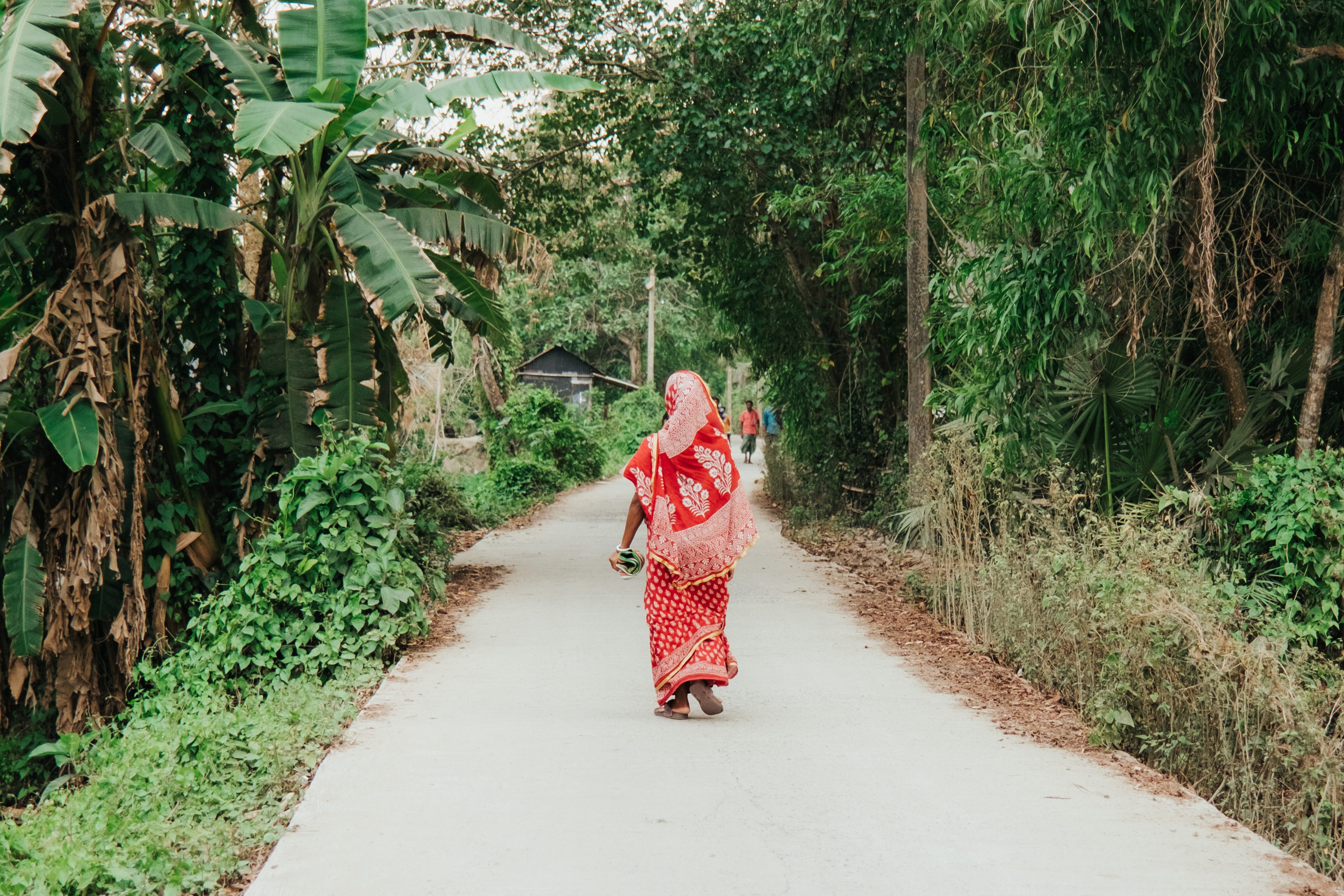 Woman walking down road