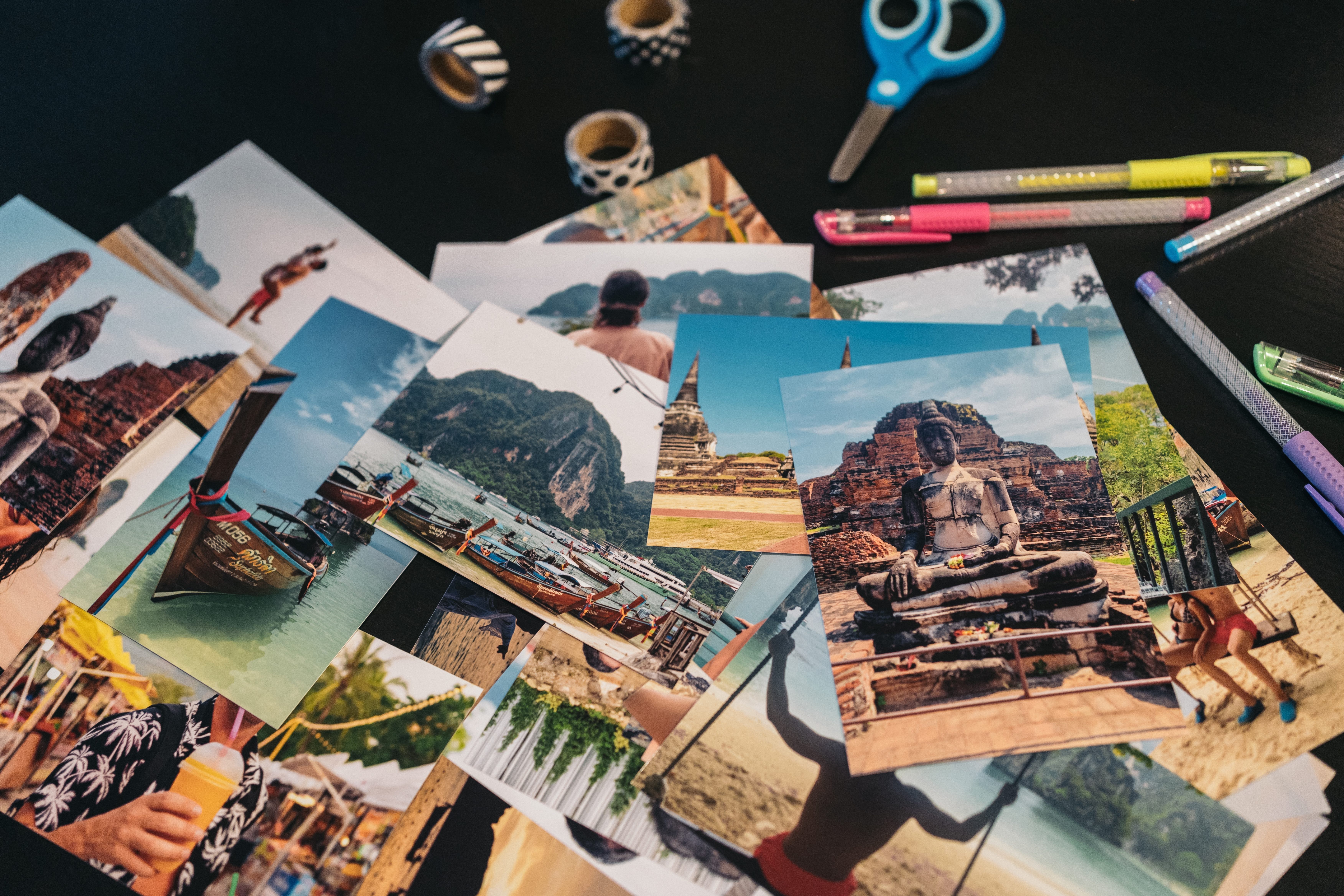 Printed travel pictures on a desk