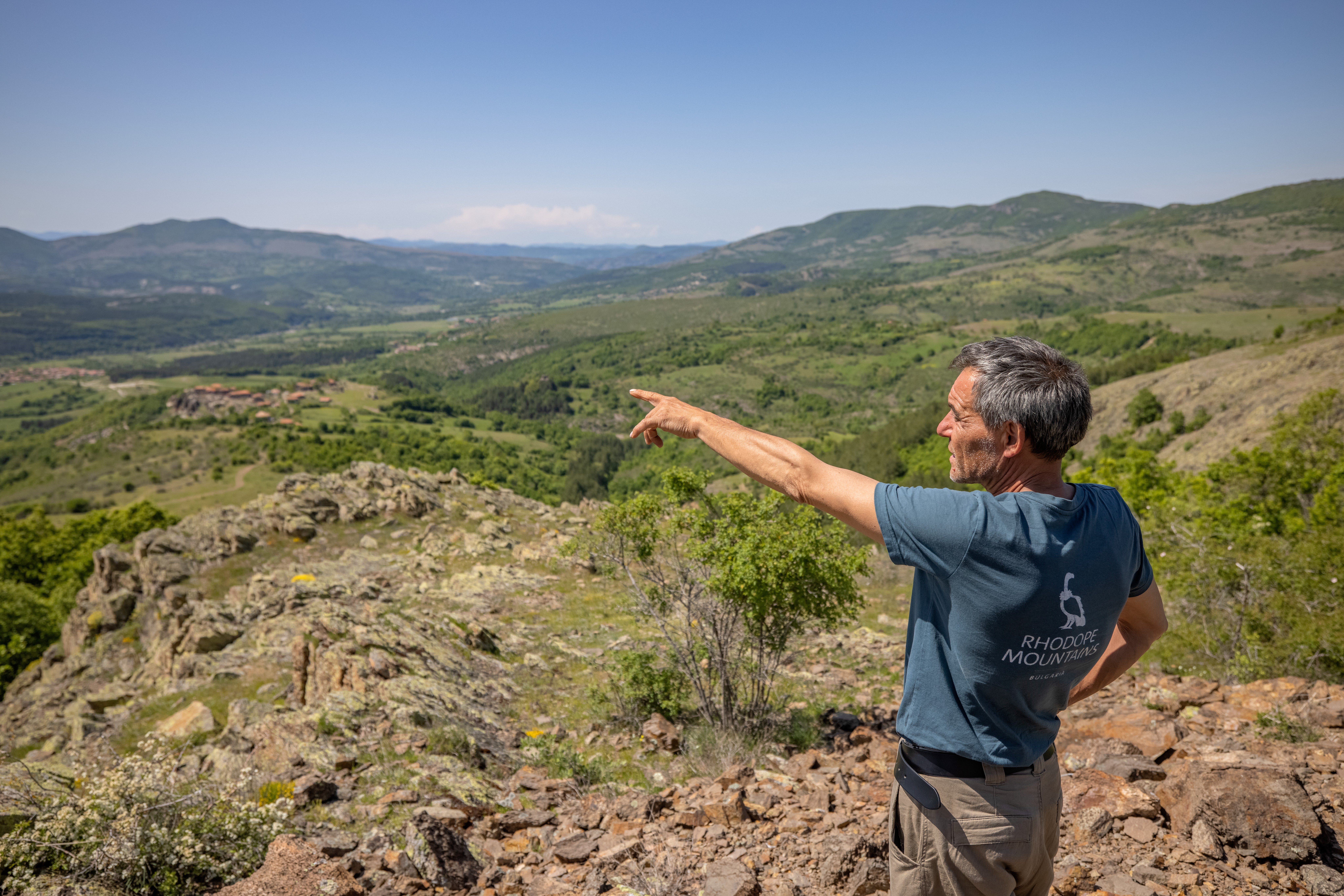 Team member pointing out to the distance