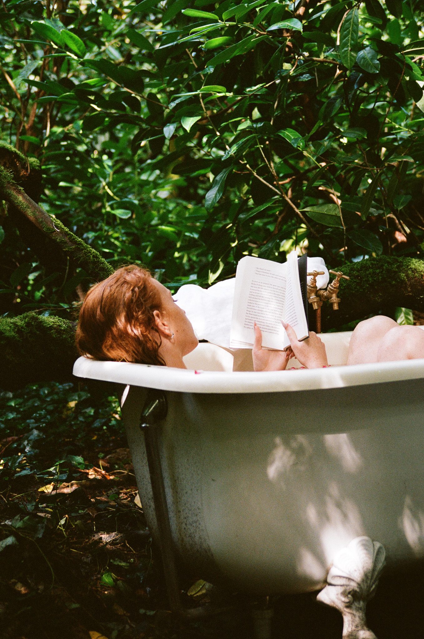 visitor taking bath outside in nature